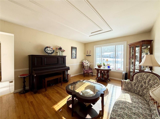 sitting room with hardwood / wood-style floors