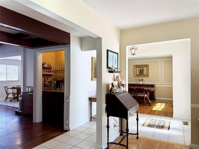 hallway featuring light tile patterned floors