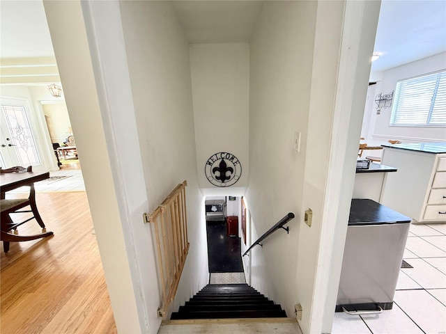 stairway featuring tile patterned floors