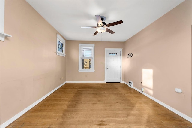 interior space with light hardwood / wood-style flooring and ceiling fan