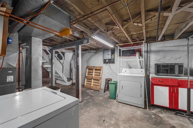 basement with washer / clothes dryer and electric panel