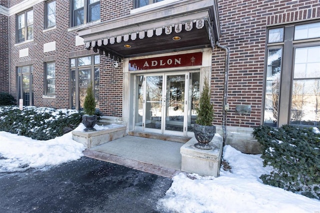 view of snow covered property entrance