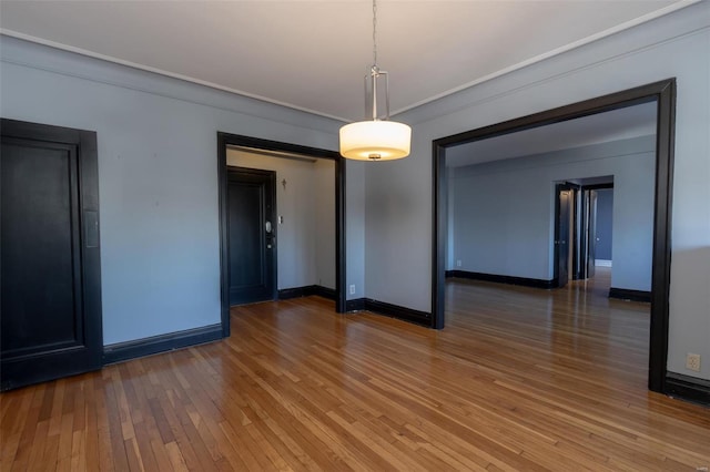 unfurnished dining area with dark wood-type flooring