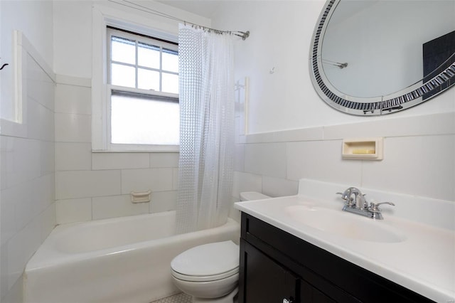 full bathroom with tile walls, toilet, shower / bath combination with curtain, and vanity