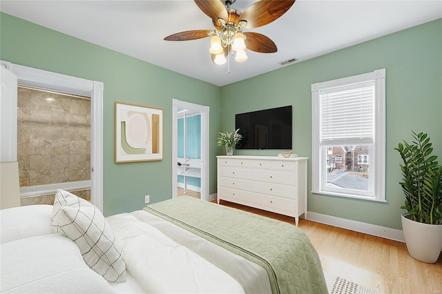 bedroom featuring light hardwood / wood-style floors and ceiling fan