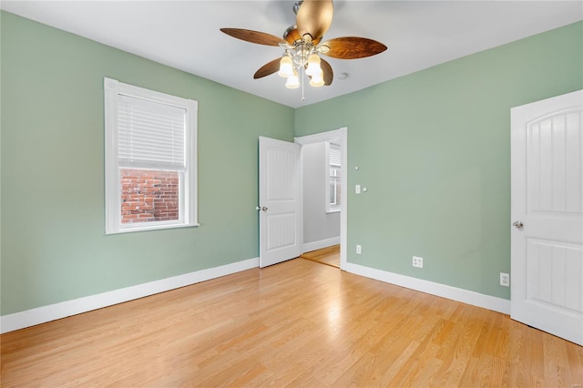 unfurnished bedroom with ceiling fan and light hardwood / wood-style flooring