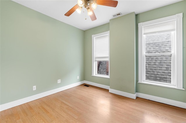 unfurnished room featuring ceiling fan and light hardwood / wood-style floors