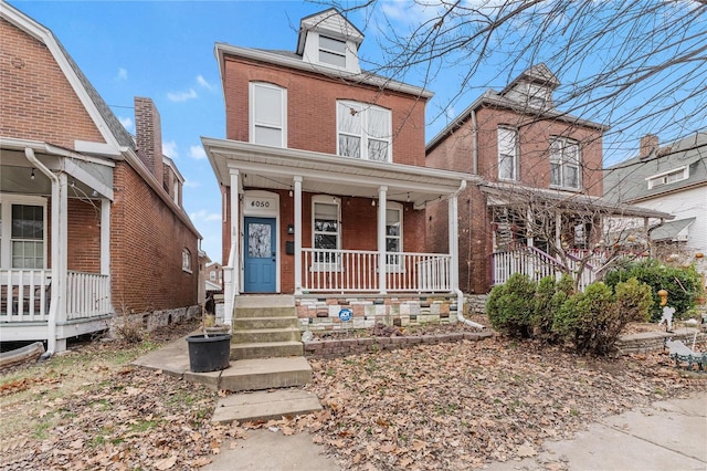 view of front of property featuring covered porch