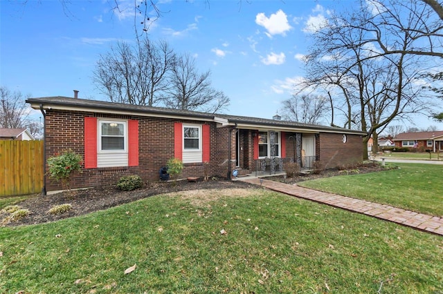 single story home featuring a front lawn