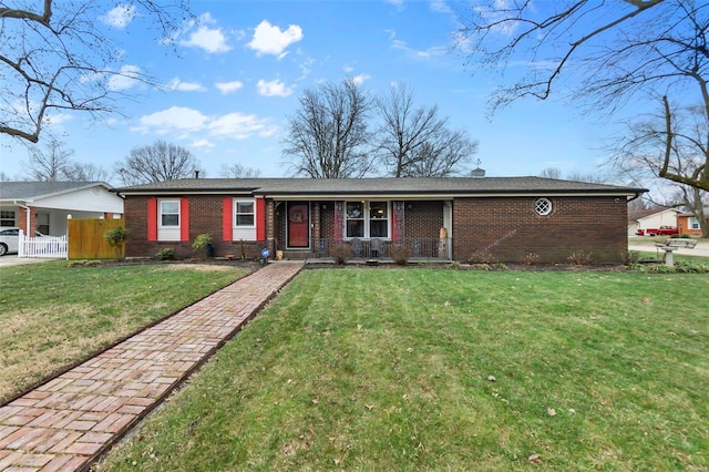 ranch-style home with a front lawn