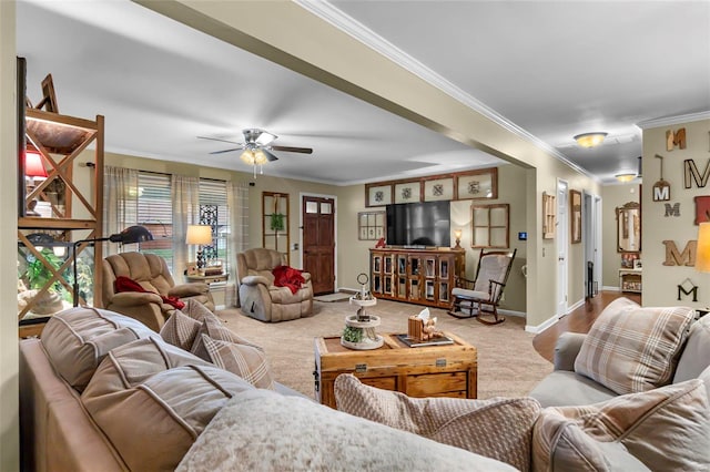 living room with carpet flooring, ceiling fan, and crown molding