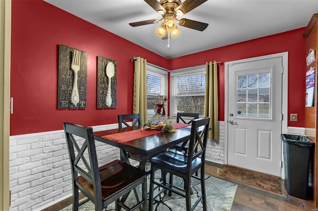 dining area featuring ceiling fan and hardwood / wood-style flooring