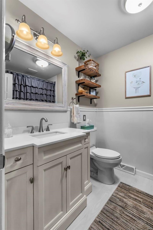 bathroom with vanity and toilet