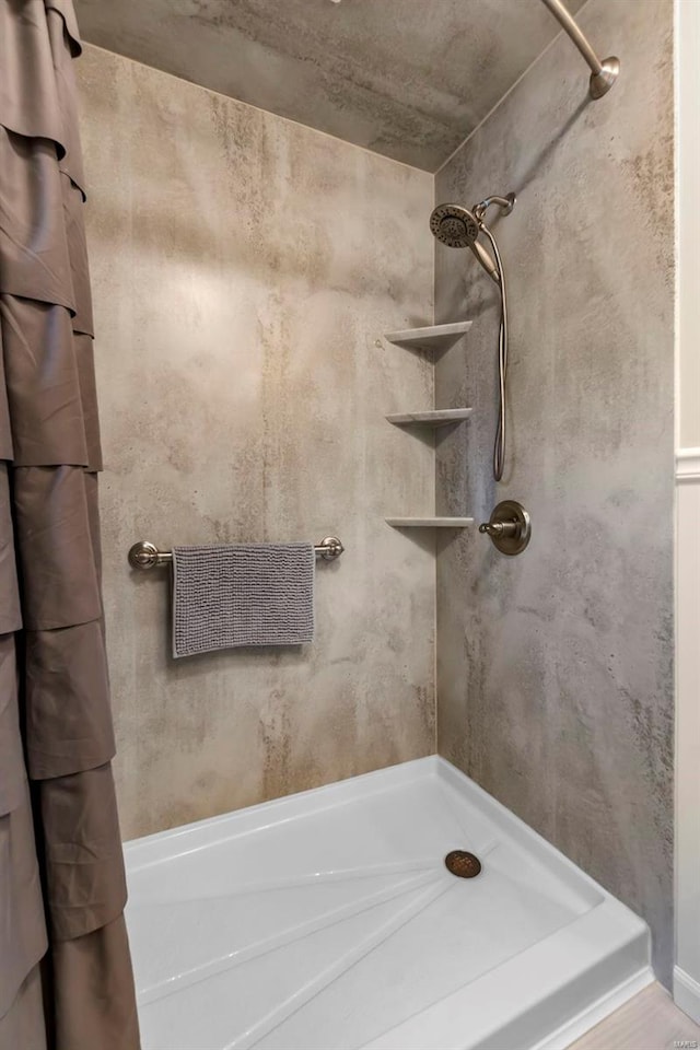 bathroom with a shower with shower curtain