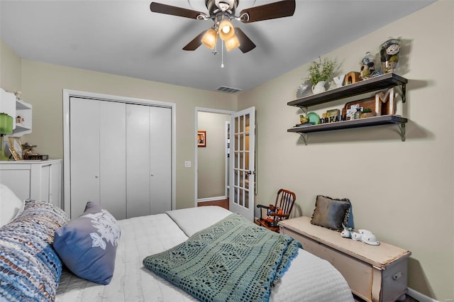 bedroom featuring ceiling fan and a closet