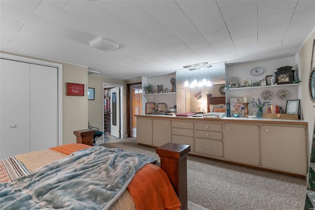 bedroom with light colored carpet and a closet