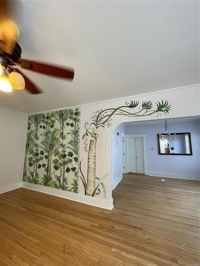 spare room with ceiling fan and hardwood / wood-style flooring