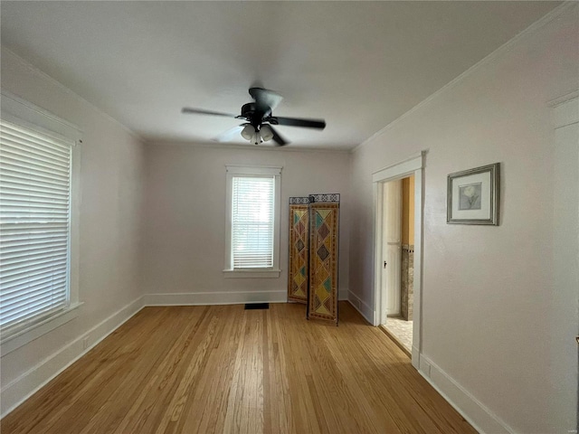 unfurnished room featuring ceiling fan and light wood-type flooring