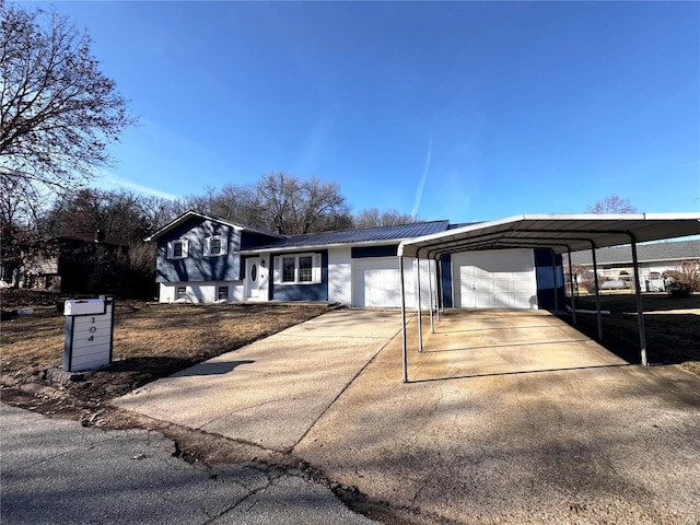 view of front of house with a carport and a garage