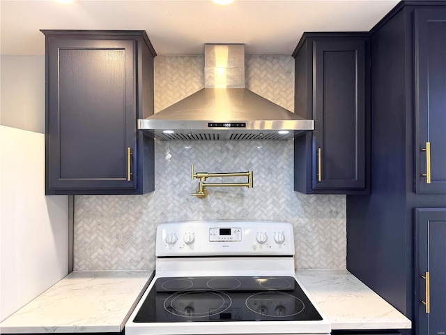 kitchen featuring white range with electric stovetop, tasteful backsplash, and wall chimney exhaust hood