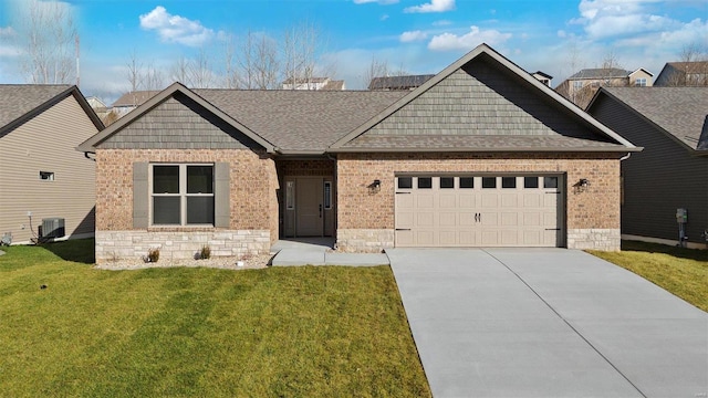 view of front facade featuring a front lawn, a garage, and central AC