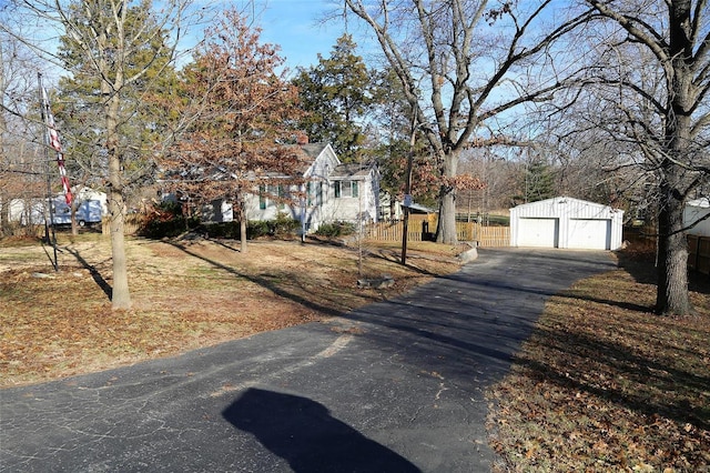 view of front of property with an outbuilding and a garage