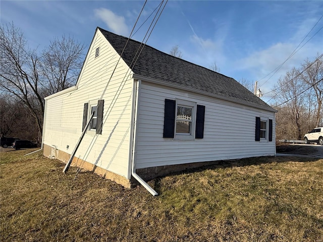 view of home's exterior with a yard