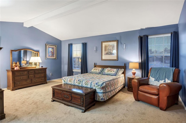 carpeted bedroom with lofted ceiling with beams