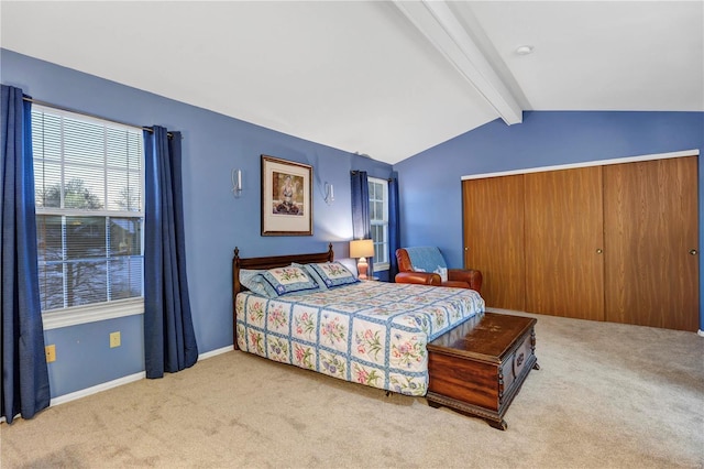 carpeted bedroom with lofted ceiling with beams