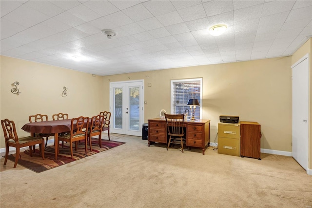 dining area featuring french doors and carpet floors