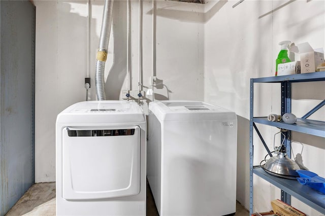 laundry area with washing machine and clothes dryer