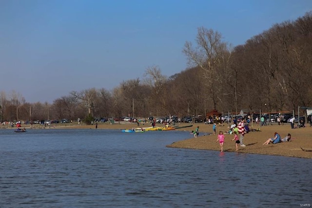 view of home's community with a water view