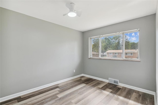 spare room featuring ceiling fan and light wood-type flooring