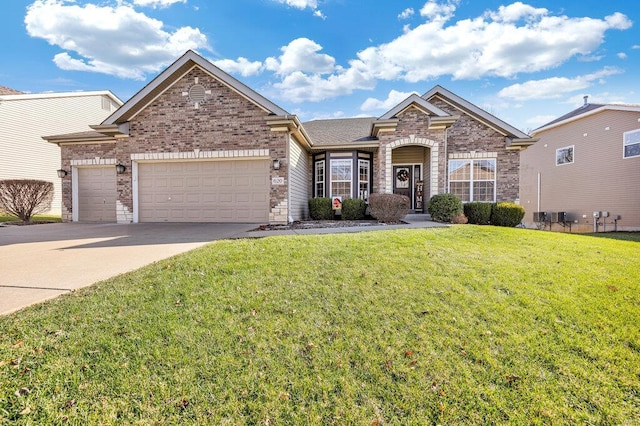 view of front of property featuring a garage and a front lawn