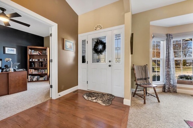 entrance foyer with ceiling fan and wood-type flooring