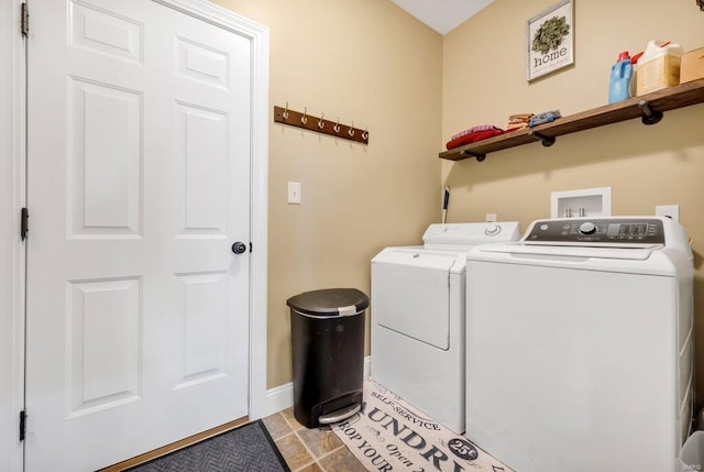 washroom featuring washer and dryer