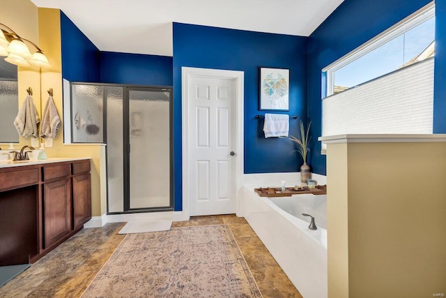 bathroom featuring vanity and shower with separate bathtub