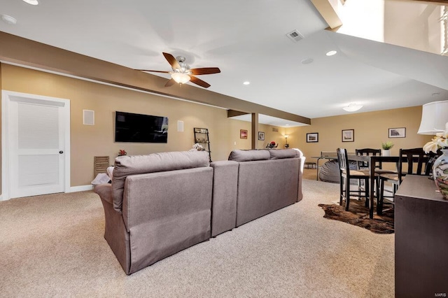 living room featuring light carpet and ceiling fan