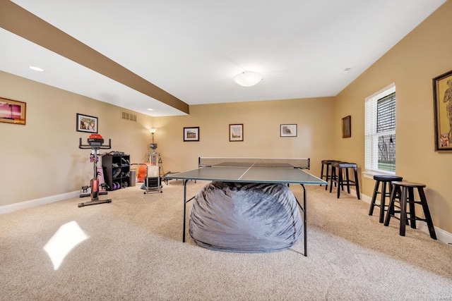 recreation room featuring light colored carpet