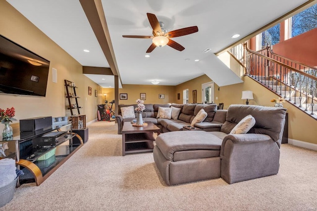 living room featuring light carpet and ceiling fan