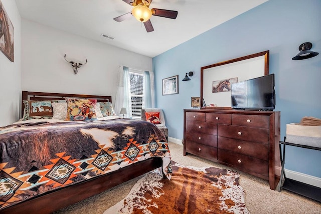 bedroom featuring ceiling fan and light colored carpet