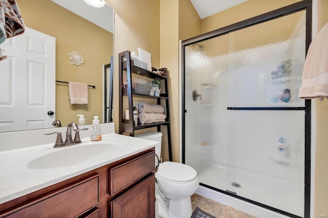 bathroom featuring walk in shower, vanity, and toilet