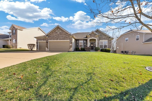 view of front of home featuring a garage and a front yard