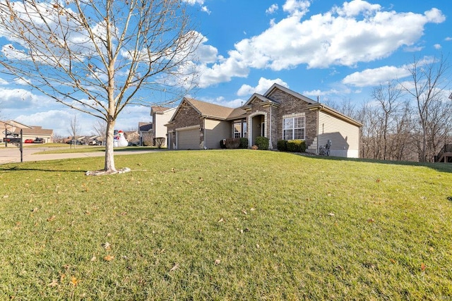 view of front of house featuring a front yard and a garage