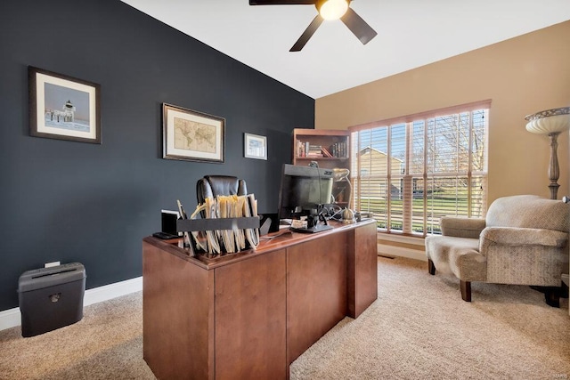 home office with light carpet and ceiling fan