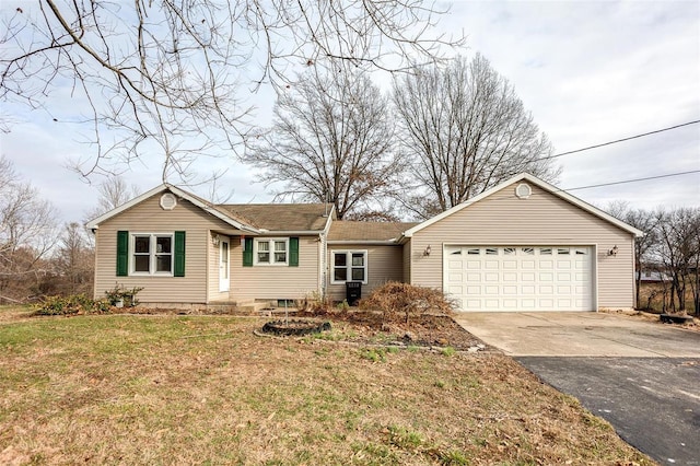 ranch-style house with a front yard and a garage