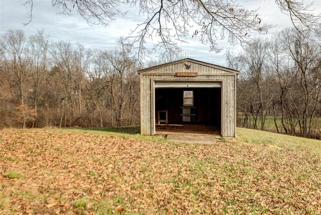 view of outbuilding with a lawn