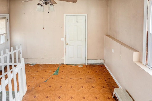 entrance to property with ceiling fan