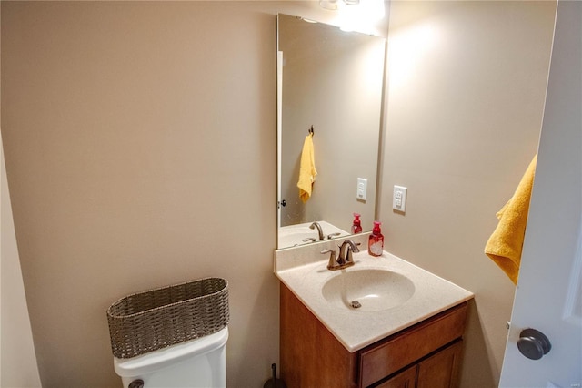 bathroom with toilet and vanity