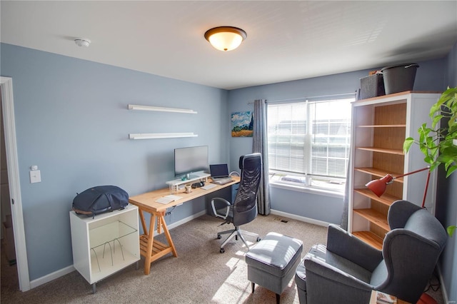 office area featuring carpet, visible vents, and baseboards